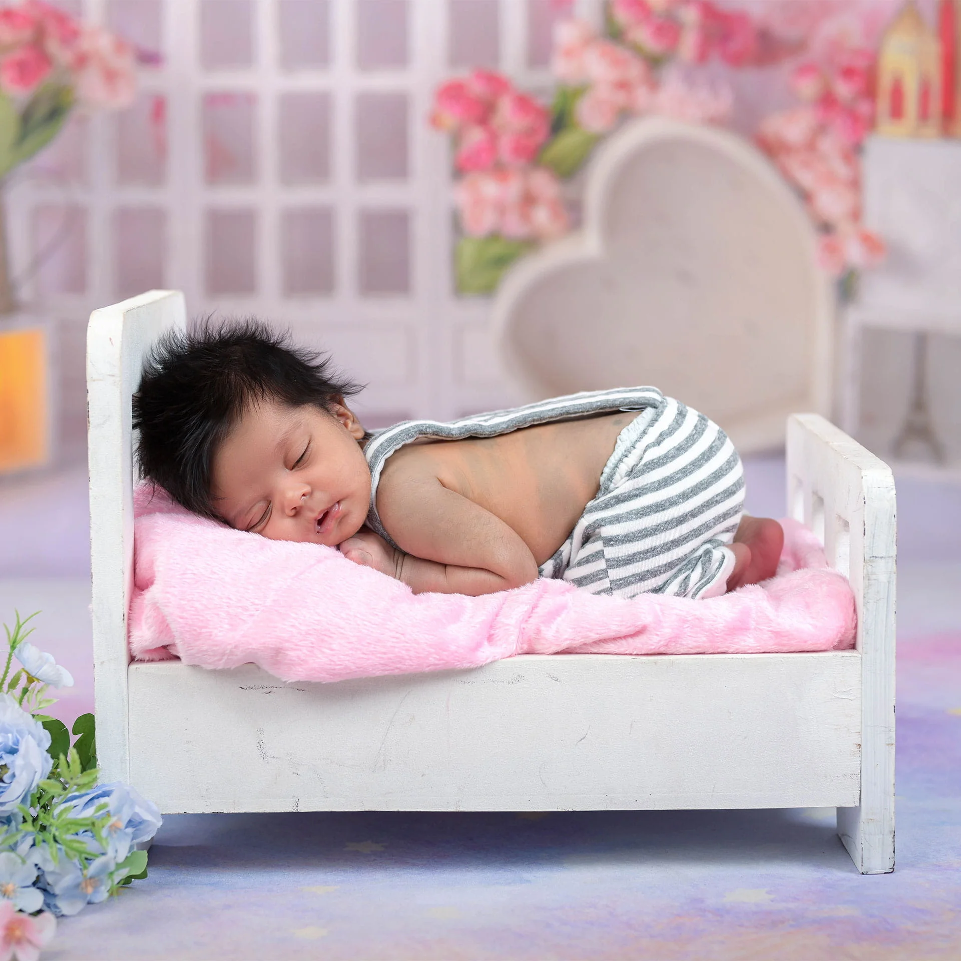 newborn baby in cot