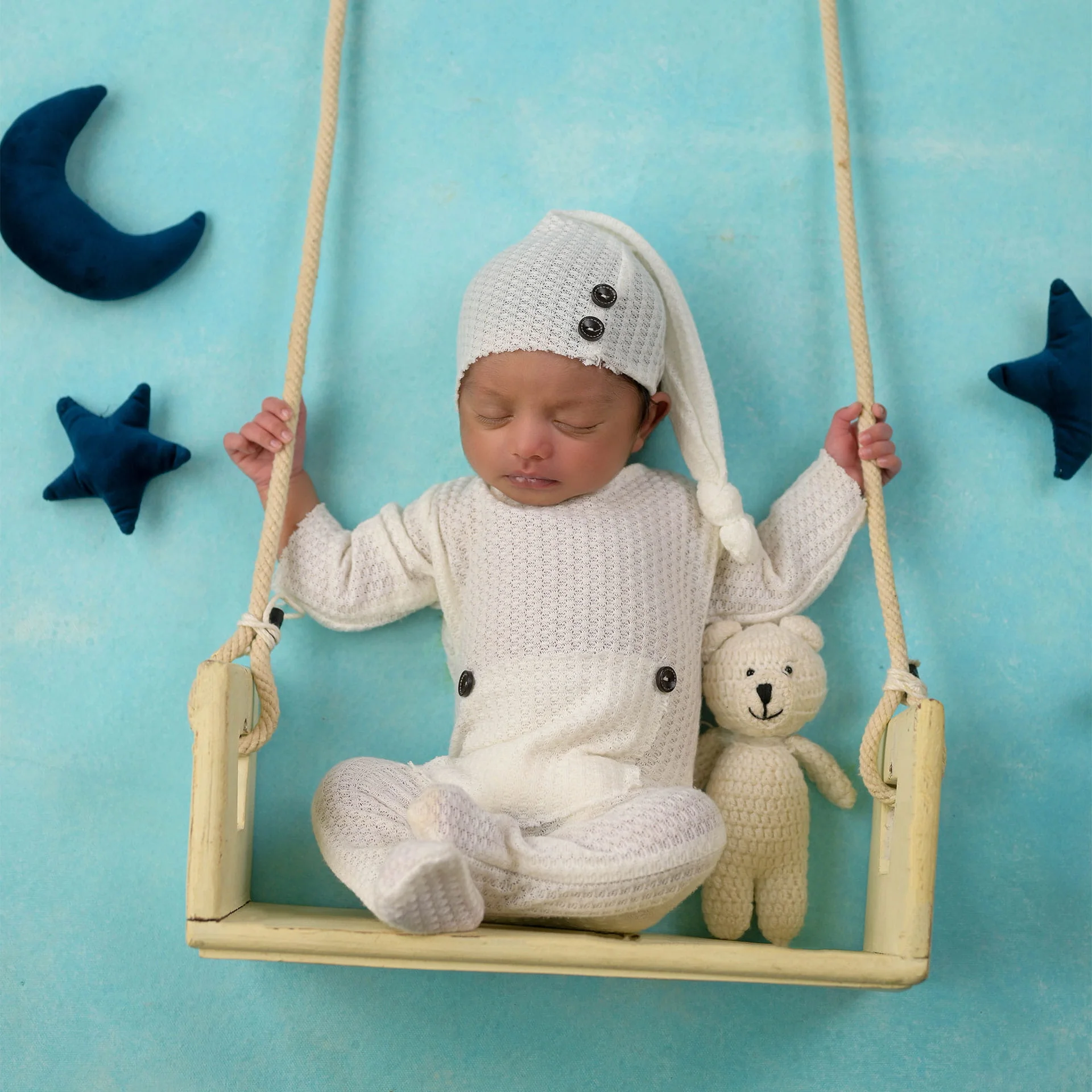 newborn in swing prop