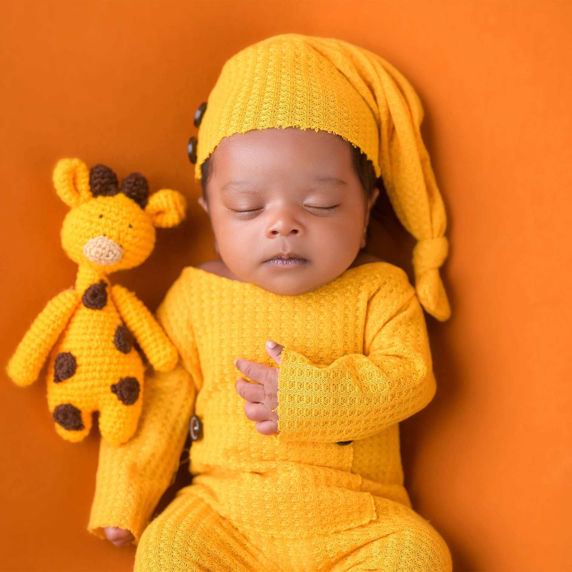 newborn in orange and yellow color