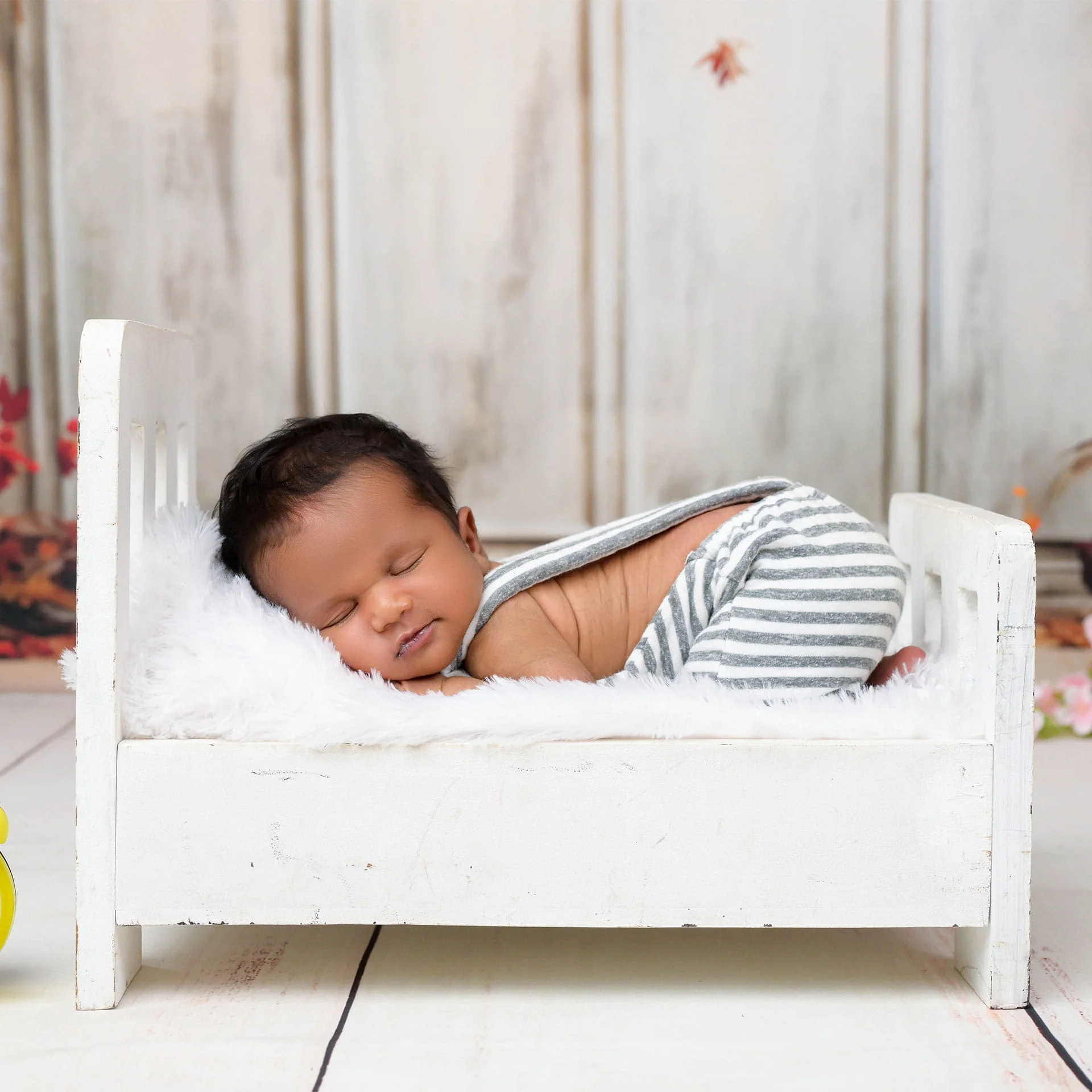 newborn in bed