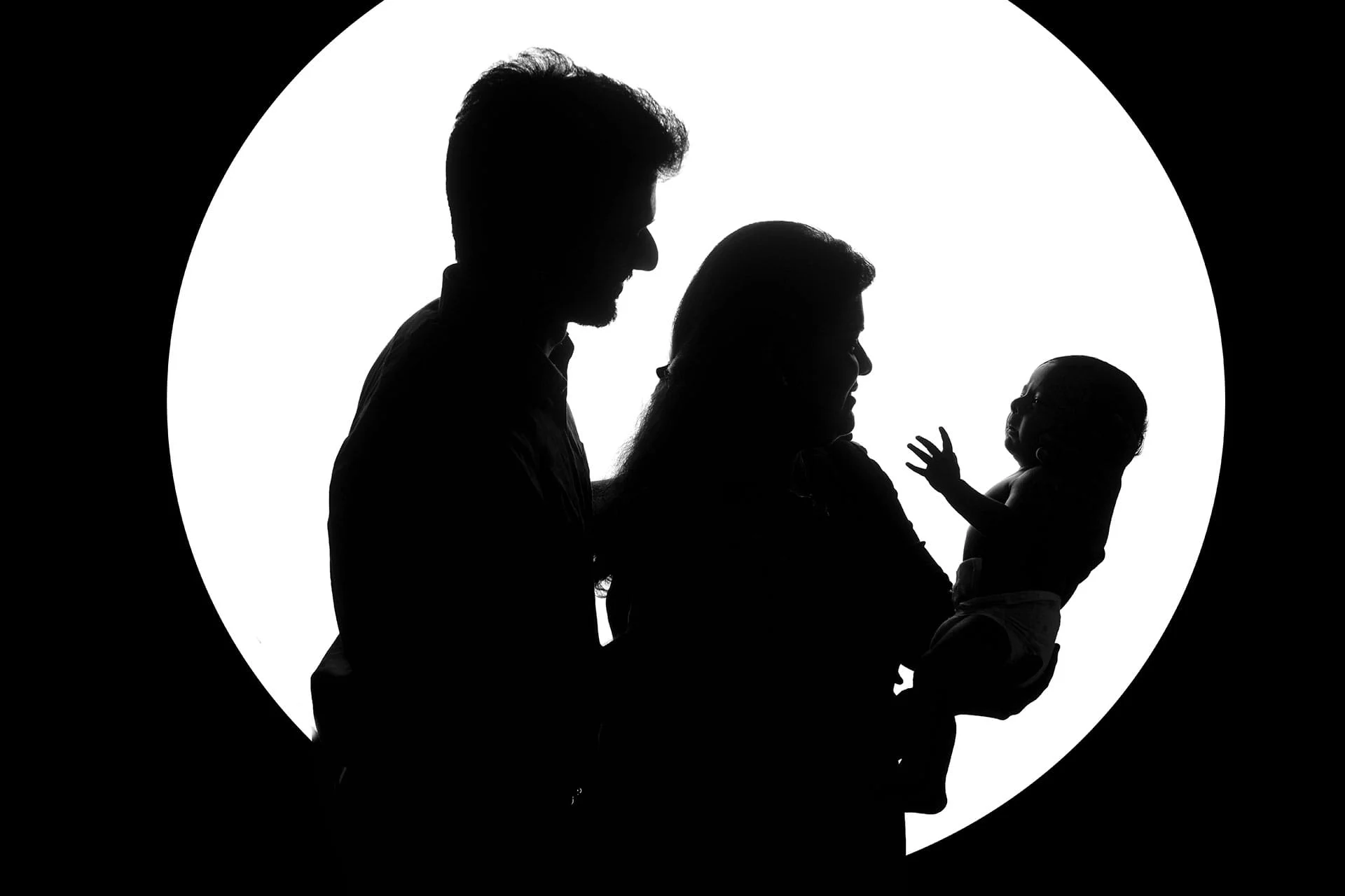 family photoshoot in black and white silhouette